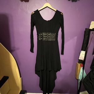 Royal Bones Black dress with lace sleeves and an asymmetrical skirt.